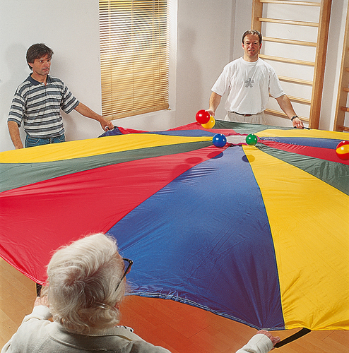 Parachute de jeu multicolore pour activités de groupe.